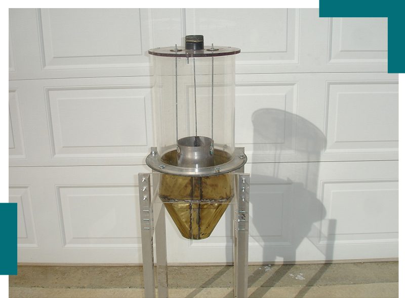 A picture of a large glass jar on top of a stand.