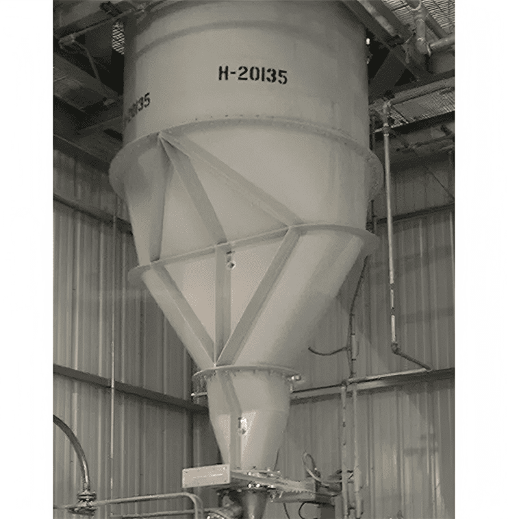 Industrial hopper in a metal-walled facility.
