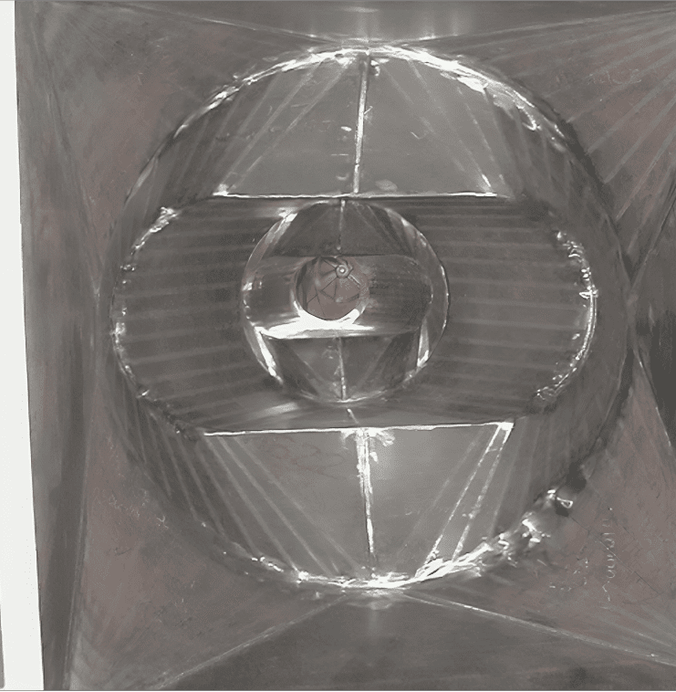 Reflective surface with circular pattern design.