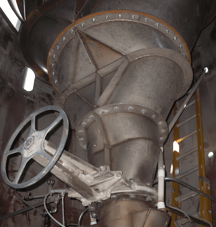 Industrial machinery with large wheel and ladder.