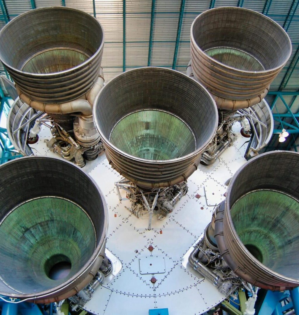 Five large rocket engine nozzles from above.